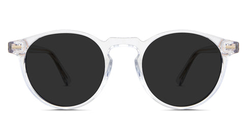 Carey black tinted Standard Solid in the Crystal variant - it's a transparent round-shaped frame with a medium-width nose bridge and a slim temple.