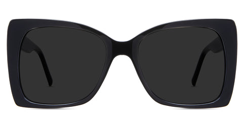 Ella black tinted Standard Solid sunglasses in the Licorice variant - is an acetate frame with an 18mm width nose bridge and a decorative metal connecting the hinge to the arm.